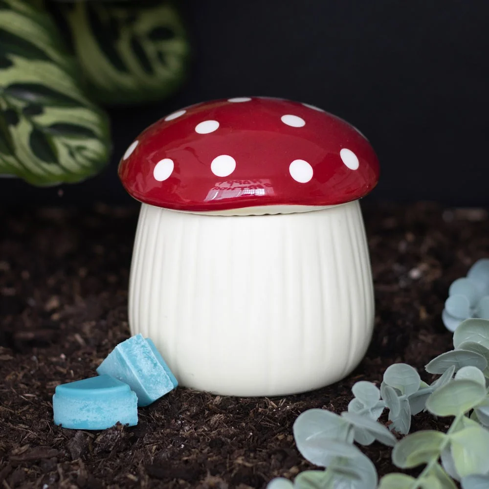 Ceramic mushroom oil burner with red cap and white spots, designed for fragrancing with tealight underneath