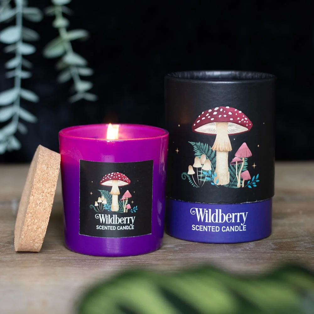 Wildberry scented candle with mystical mushroom design in glass jar, warm and inviting for dark forest ambiance