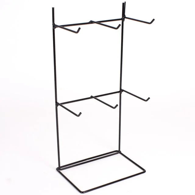 6‑hook metal display stand on a countertop, holding necklaces and small hanging signs.