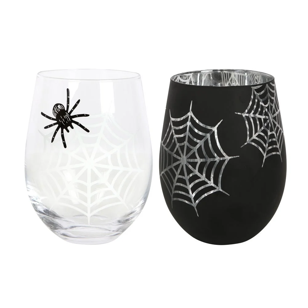 Set of 2 stemless wine glasses with spider and web designs, one clear with printed spider, one black with silver web interior