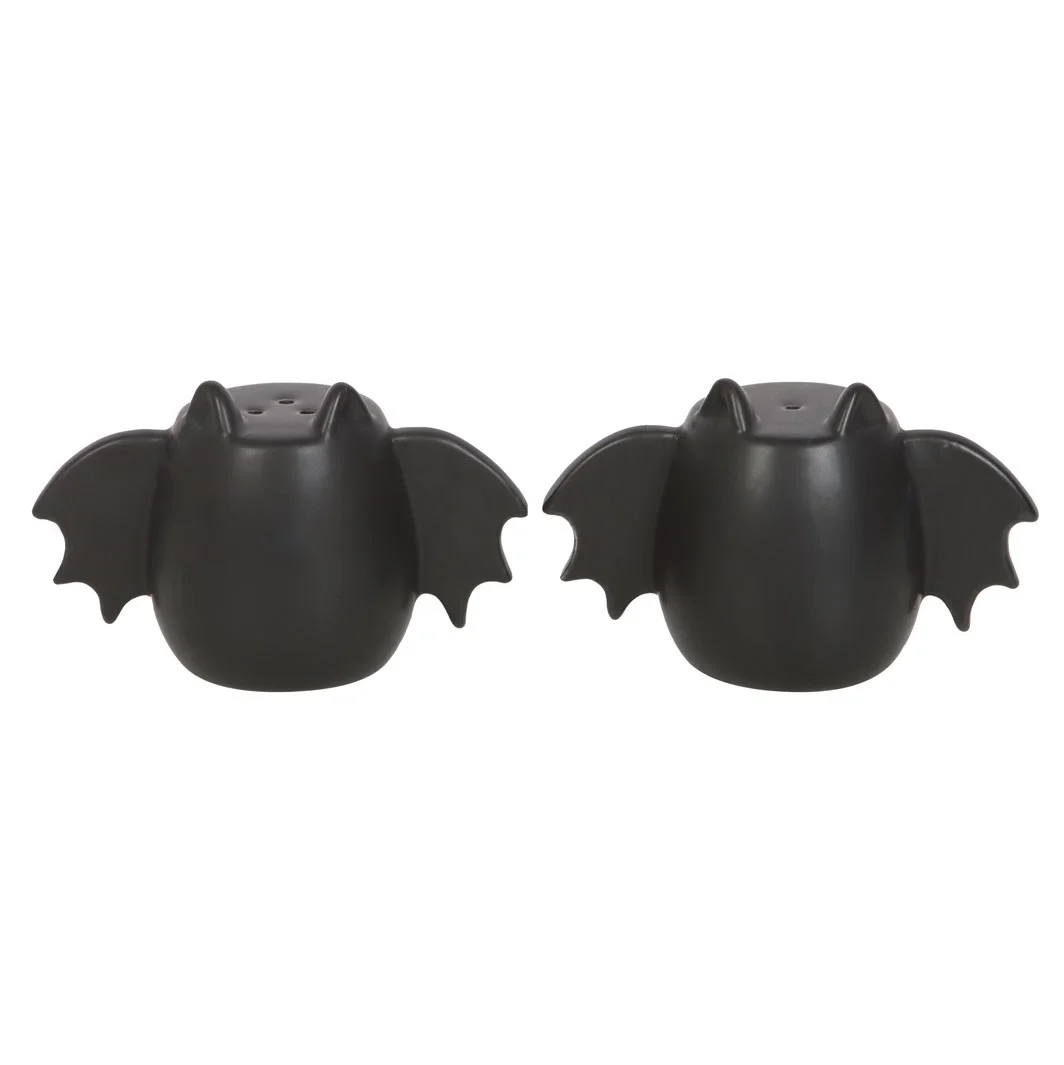 Pair of bat wing salt shakers and pepper shakers in black with detailed wing design on a white background