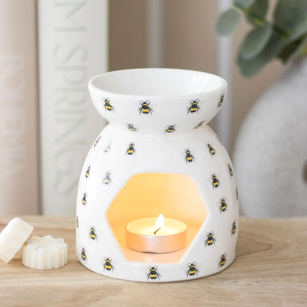Ceramic bee print oil burner with tealight holder, featuring all-over bee design, 11cm tall, square shape