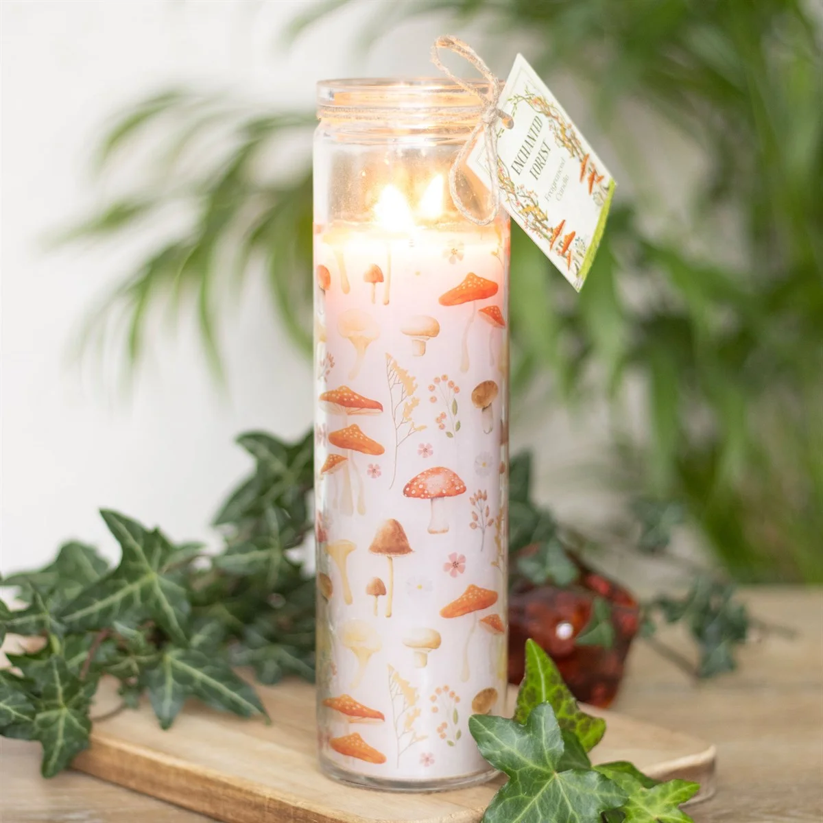 Enchanted forest candle with mushroom print on white tube, vegan paraffin wax, 65-hour burn time, 7-day prayer style
