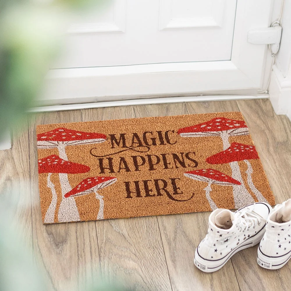 Natural Magic Happens Here mushroom design magic welcome doormat with toadstool graphic on porch floor