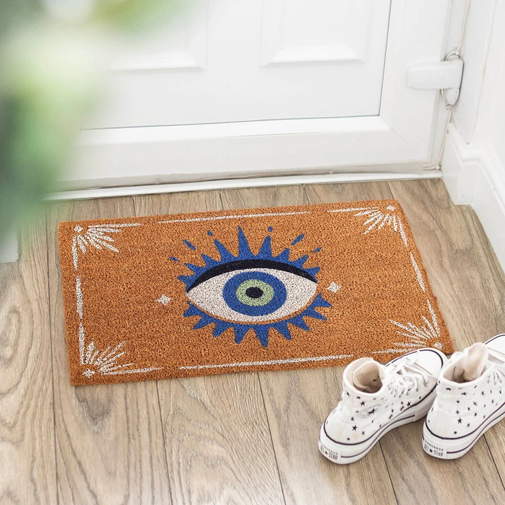 All Seeing Eye doormat with blue eye design on natural textured mat, perfect for front door.
