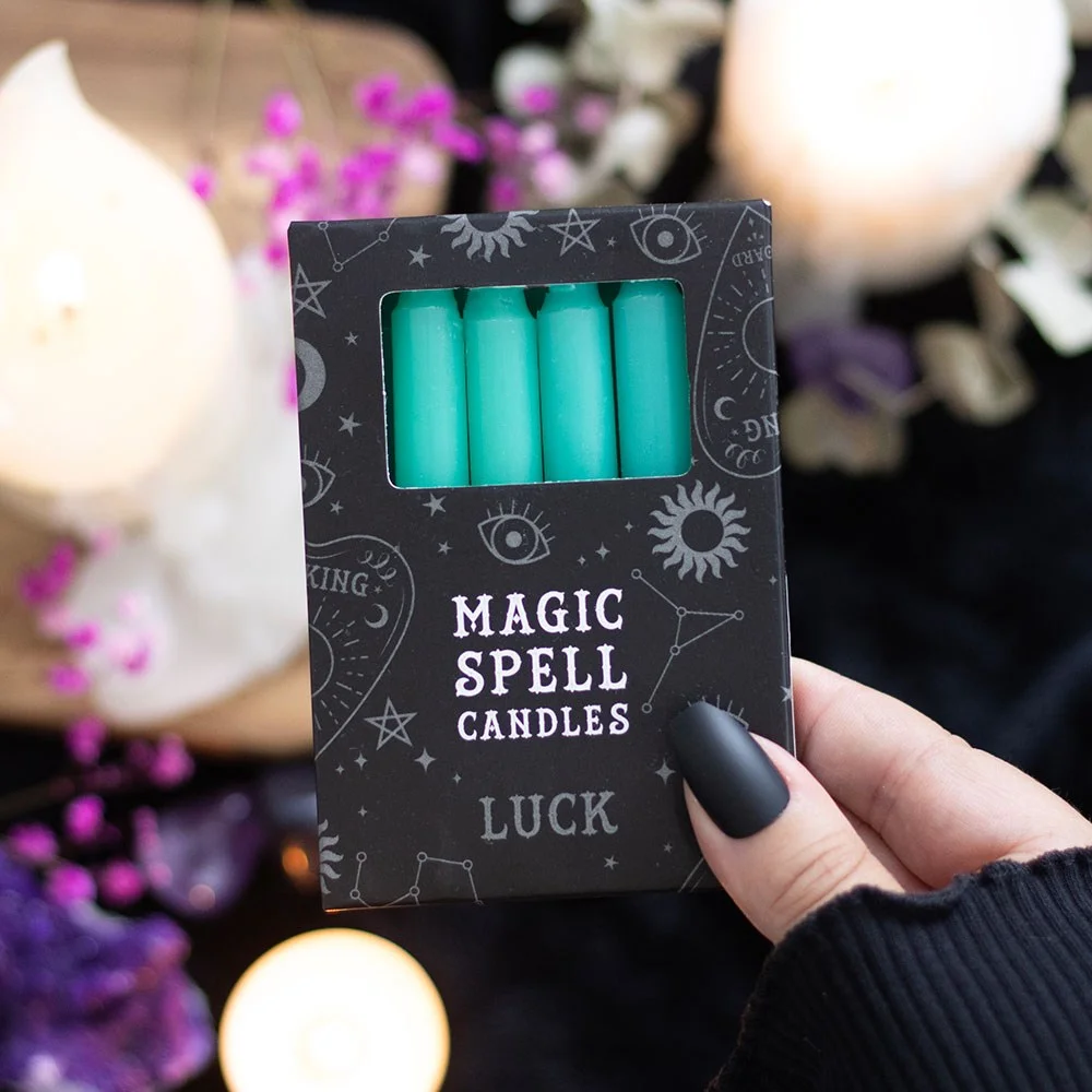 12 bright green candles in a flat‑lay arrangement, packaged as green luck candles for rituals