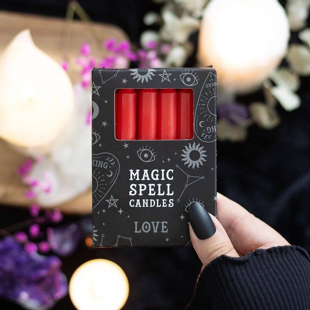 Set of twelve red love candles displayed in a pack.