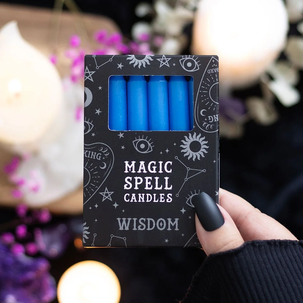 Set of 12 dark blue spell candles arranged in two rows, labeled 'Wisdom' for ritual use, vegan and unscented.