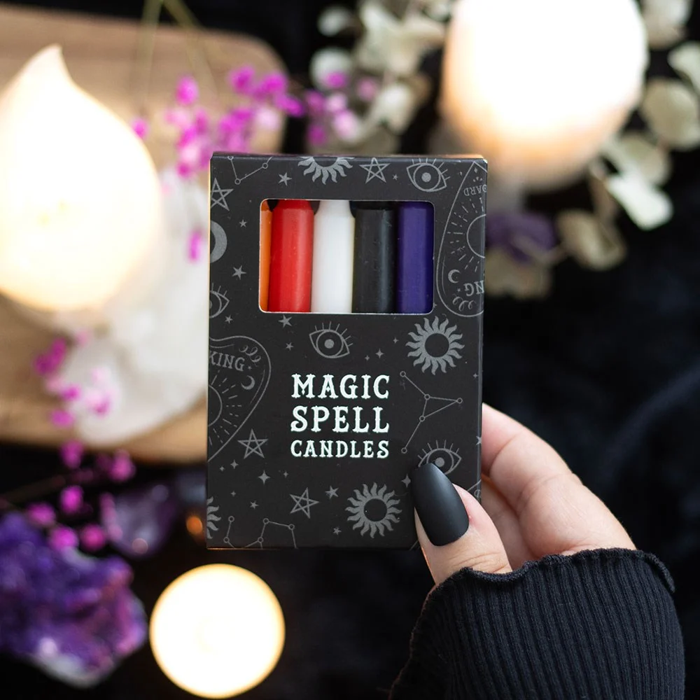 Set of 12 mixed spell candles in black, white, purple, dark blue, light blue, orange, green, red, yellow and pink.