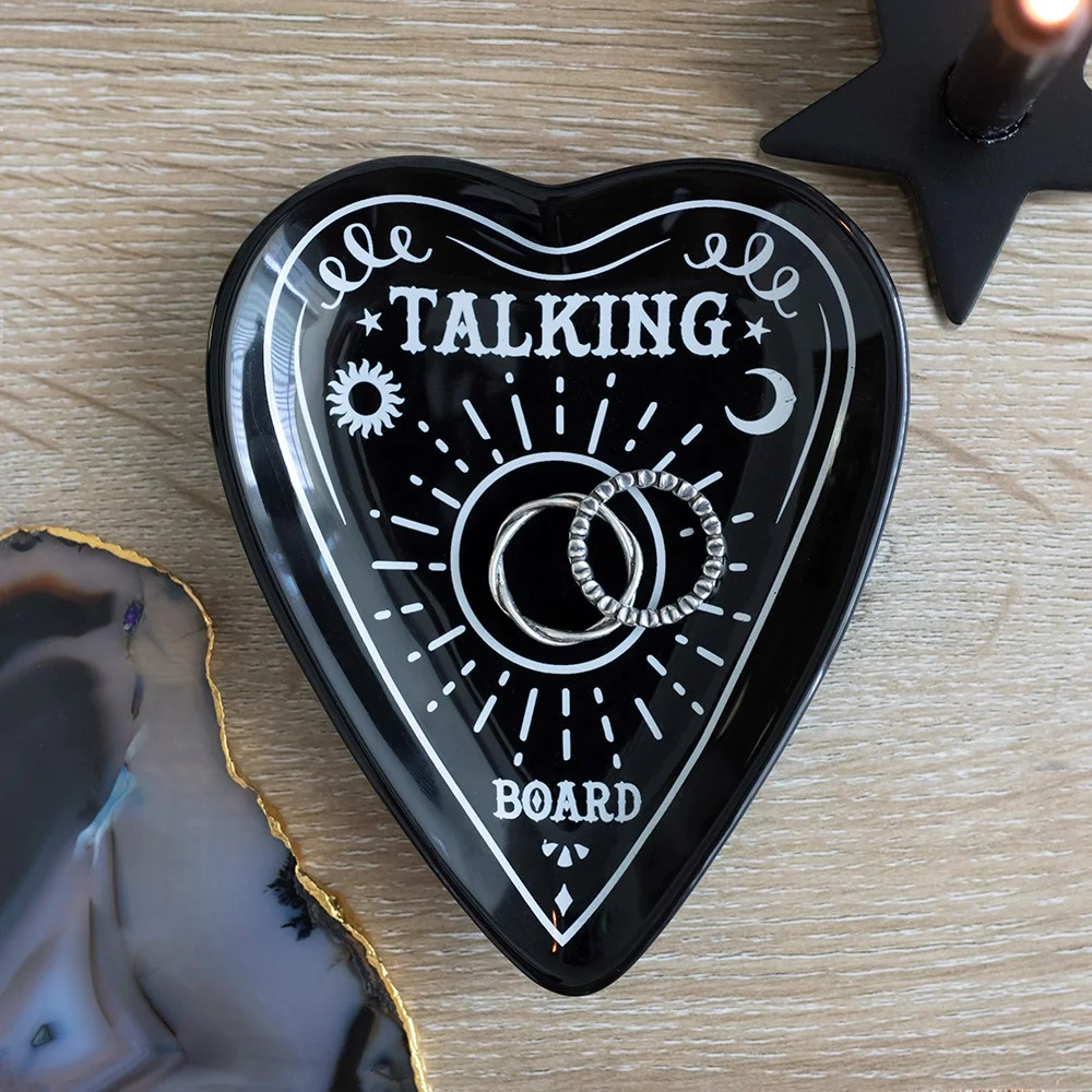 Ceramic talking board trinket dish shaped like a classic planchette holding small jewellery and accessories