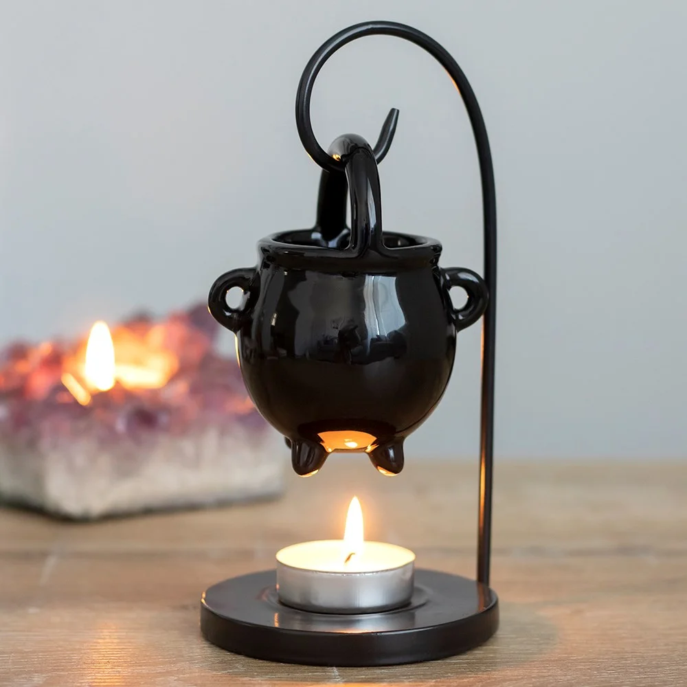 Ceramic hanging cauldron oil burner in black with a small bowl and hanging hook for home fragrance use