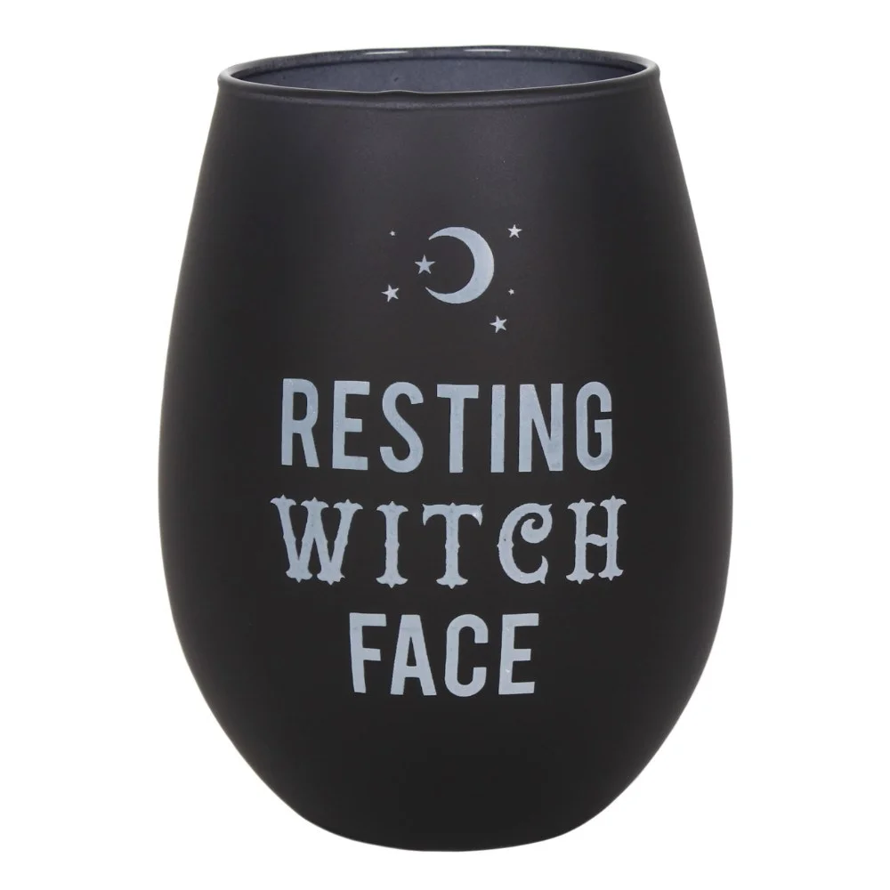 Frosted black stemless wine glass with "Resting Witch Face" text from Black Magic collection, shown with packaging box