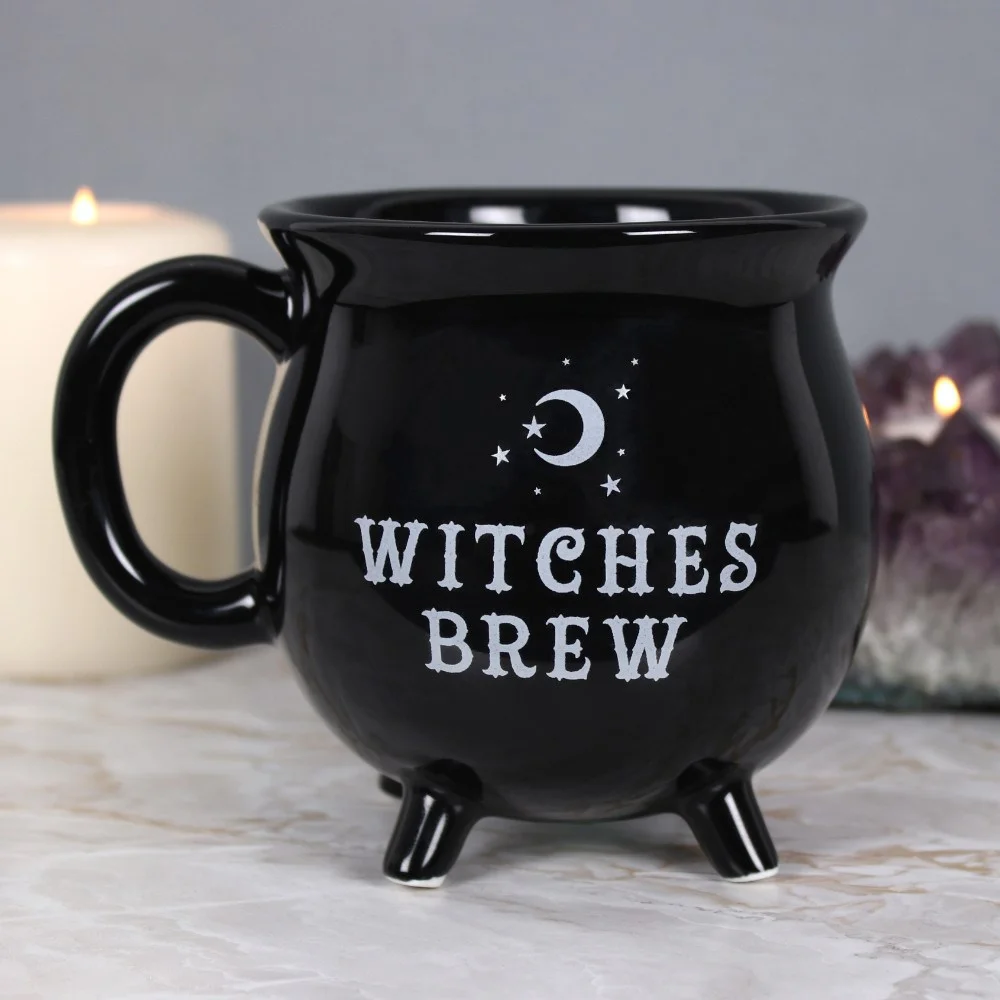 Black witches brew cauldron mug with curved handle and "Witches Brew" text, displayed on white background