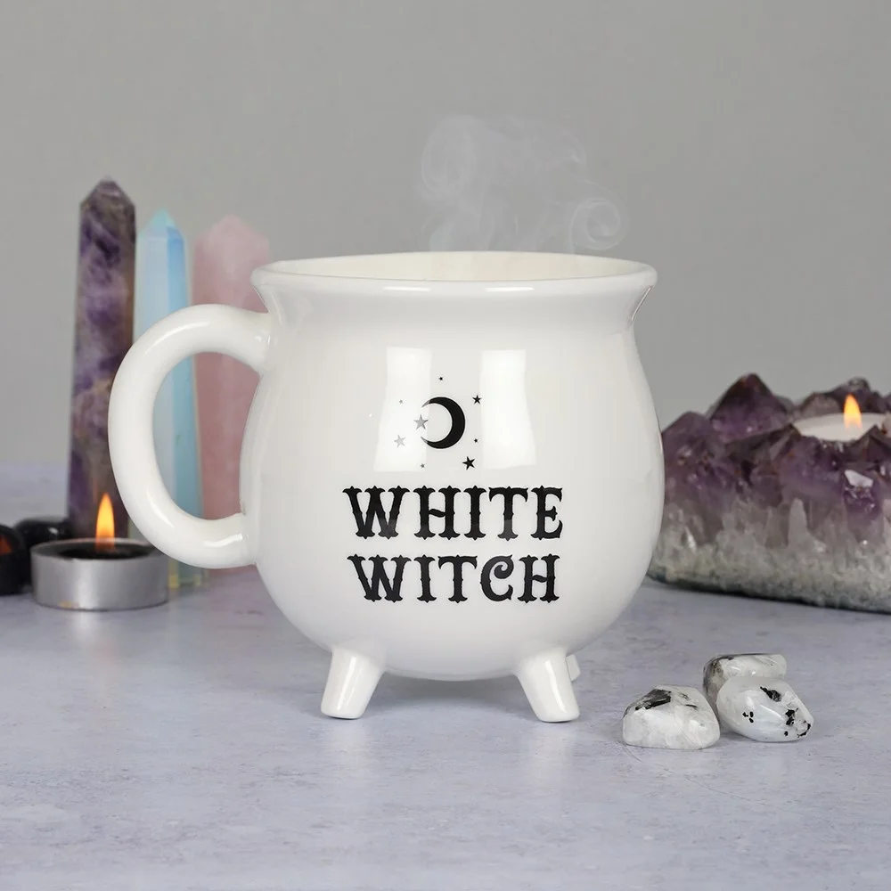 White cauldron-shaped mug with White Witch text in black, shown with matching cardboard box, 10cm tall white witch mug