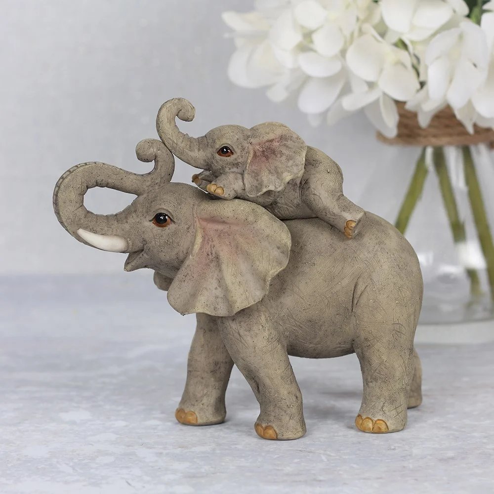 Mother and baby elephant ornament showing a cheerful, detailed sculpture symbolizing a loving bond between them