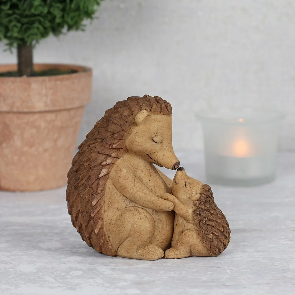 Mother and baby hedgehog ornament showing a cuddling pair, packaged with gift box and sentiment card.