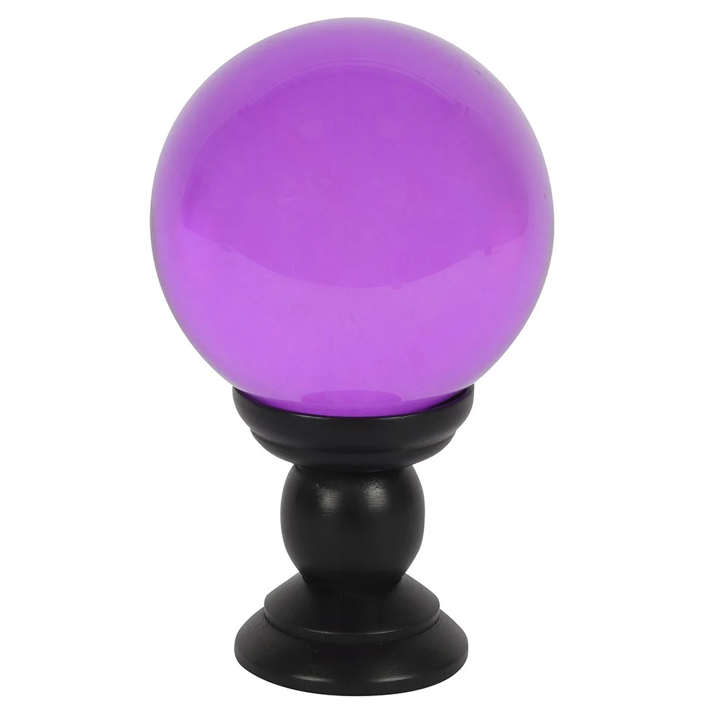 Large purple crystal ball on a black wooden stand against a white background for divination or décor use
