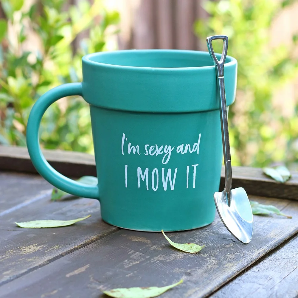 Ceramic terracotta novelty garden mug shaped like a plant pot with "I'm Sexy and I Mow It" text and shovel spoon