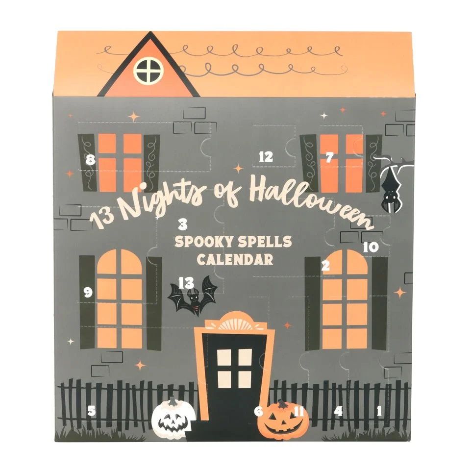Halloween advent calendar with 13 numbered doors featuring crystals, candles, tealights, and a drawstring storage bag