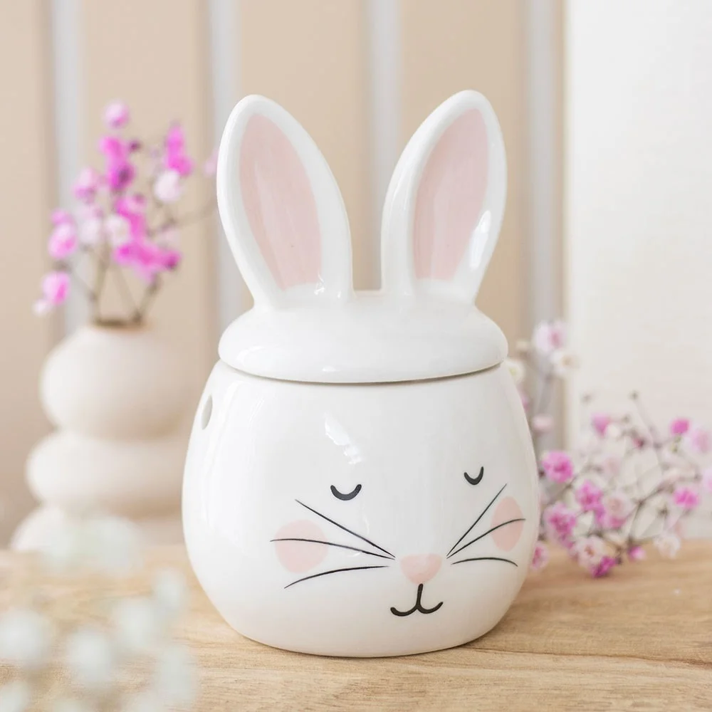 White ceramic bunny oil burner with cut-out face details, standing 15cm tall, designed for fragrance oils and tealights