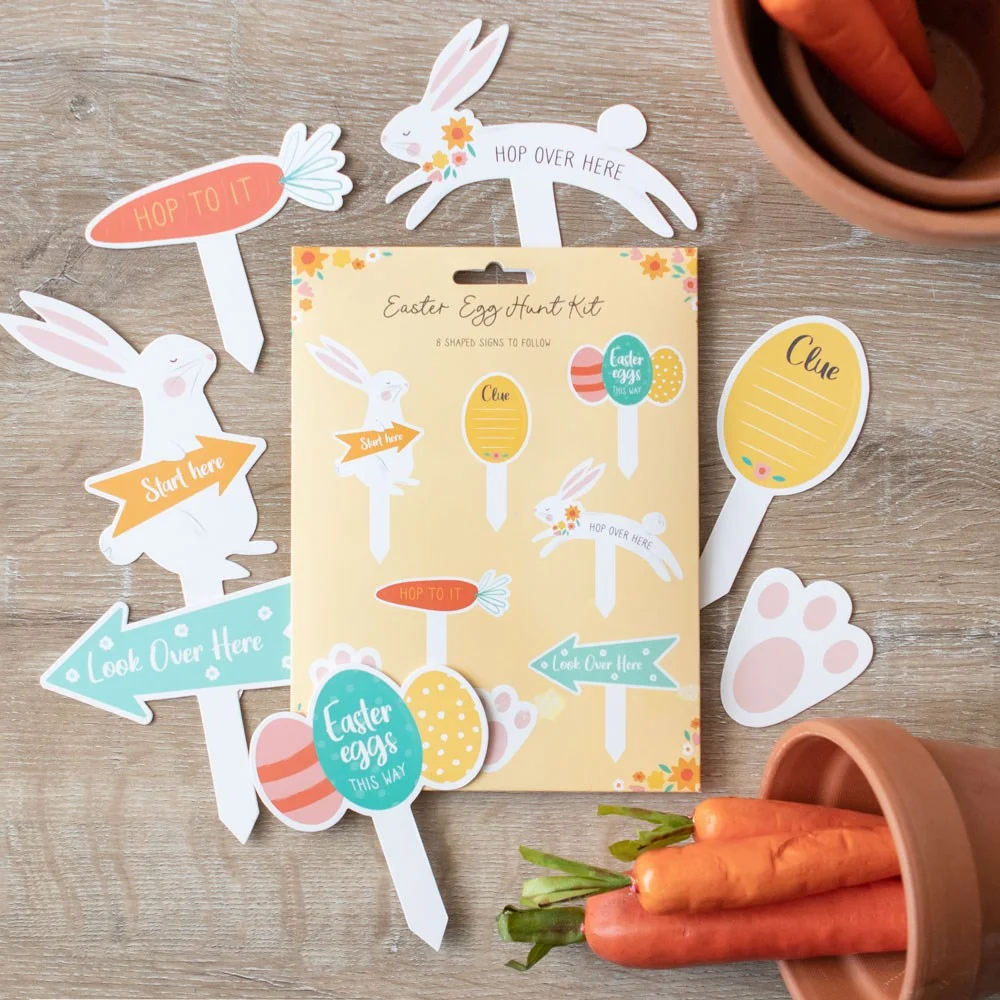 Set of 8 colorful cardboard Easter egg hunt signs with arrows and playful hints.