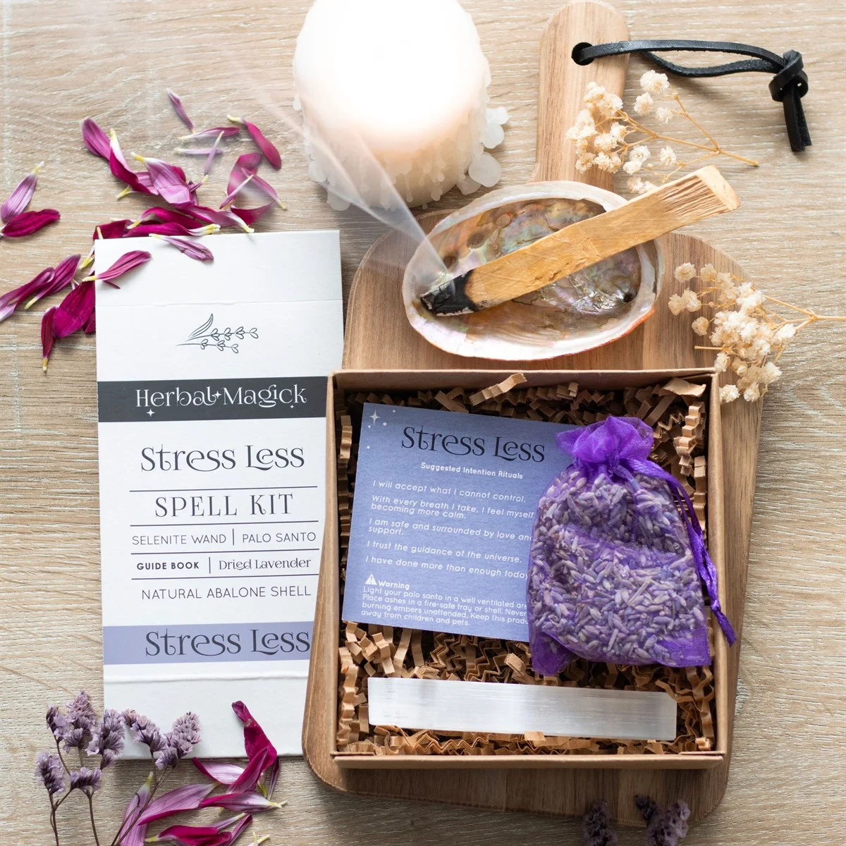 Stress Less Spell Kit with selenite wand, dried lavender, Palo Santo, abalone shell, guide book, and recyclable gift box