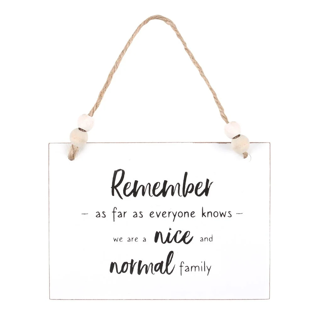 White wooden family hanging sign with humorous text, twine hanger, and wooden bead decoration, 10cm by 14cm.