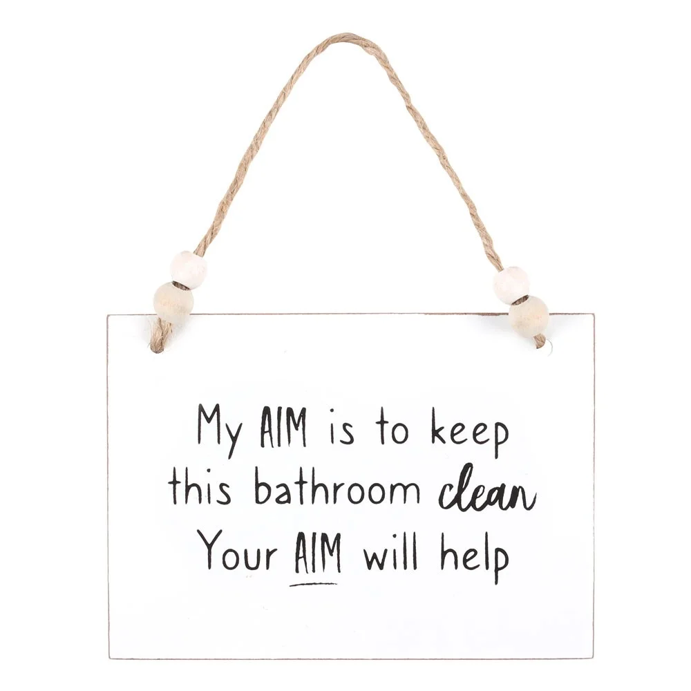 White wooden bathroom hanging sign with text about keeping the bathroom clean, twine hanger, and wooden beads