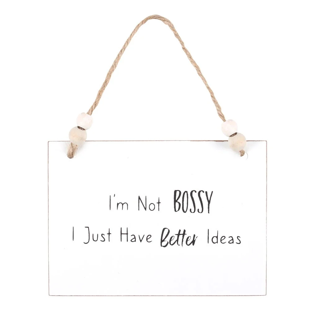 White wooden bossy hanging sign with text "I'm not bossy, I just have better ideas," twine hanger, and wooden beads