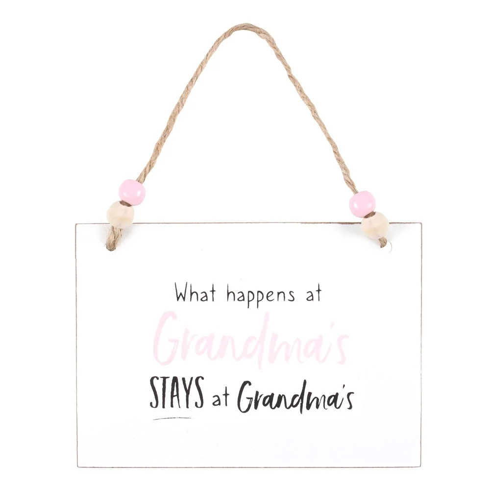 White wooden grandma hanging sign with text "What happens at Grandma's stays at Grandma's," twine and wooden beads