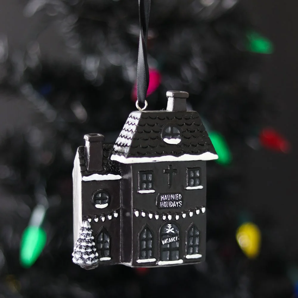 Black resin haunted house Christmas decoration with cobwebs and ghostly details, 10cm tall gothic ornament