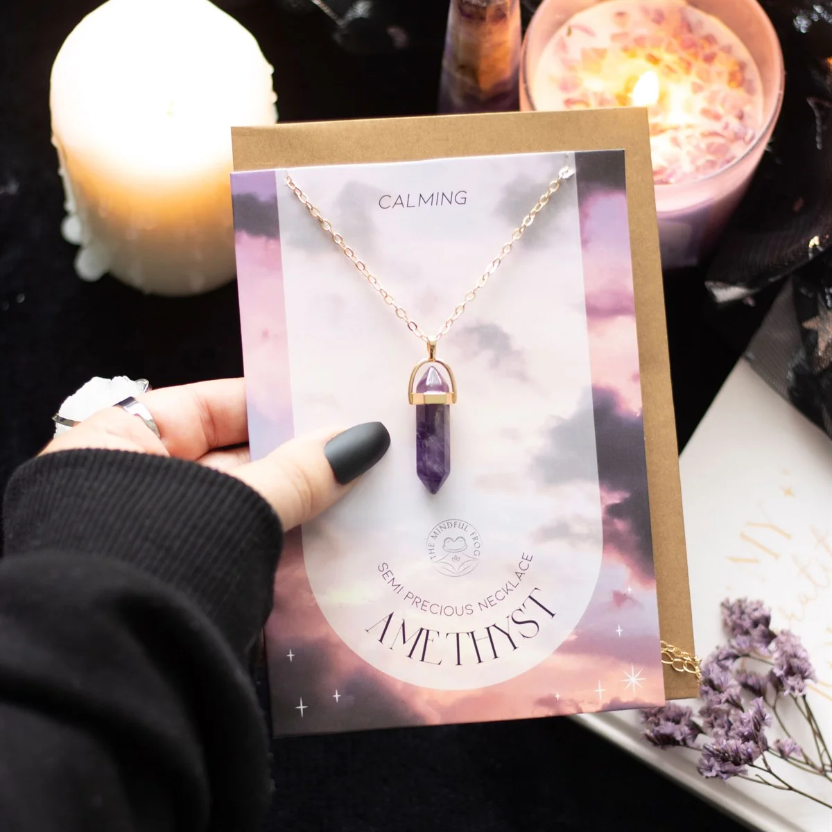 Gold-tone amethyst crystal necklace with 22cm chain displayed on a greeting card with envelope included