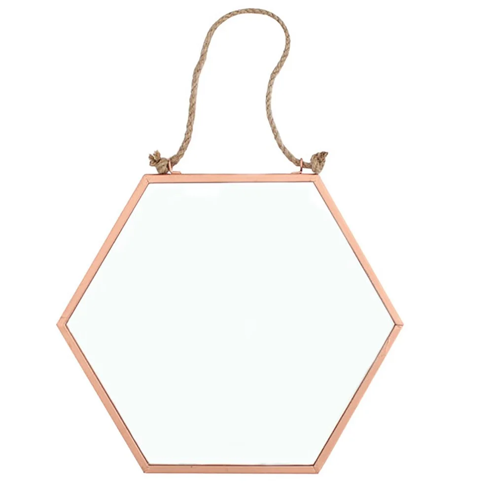Small geometric mirror with a geometric shape, measuring 17.5cm by 20cm, ideal for home décor.