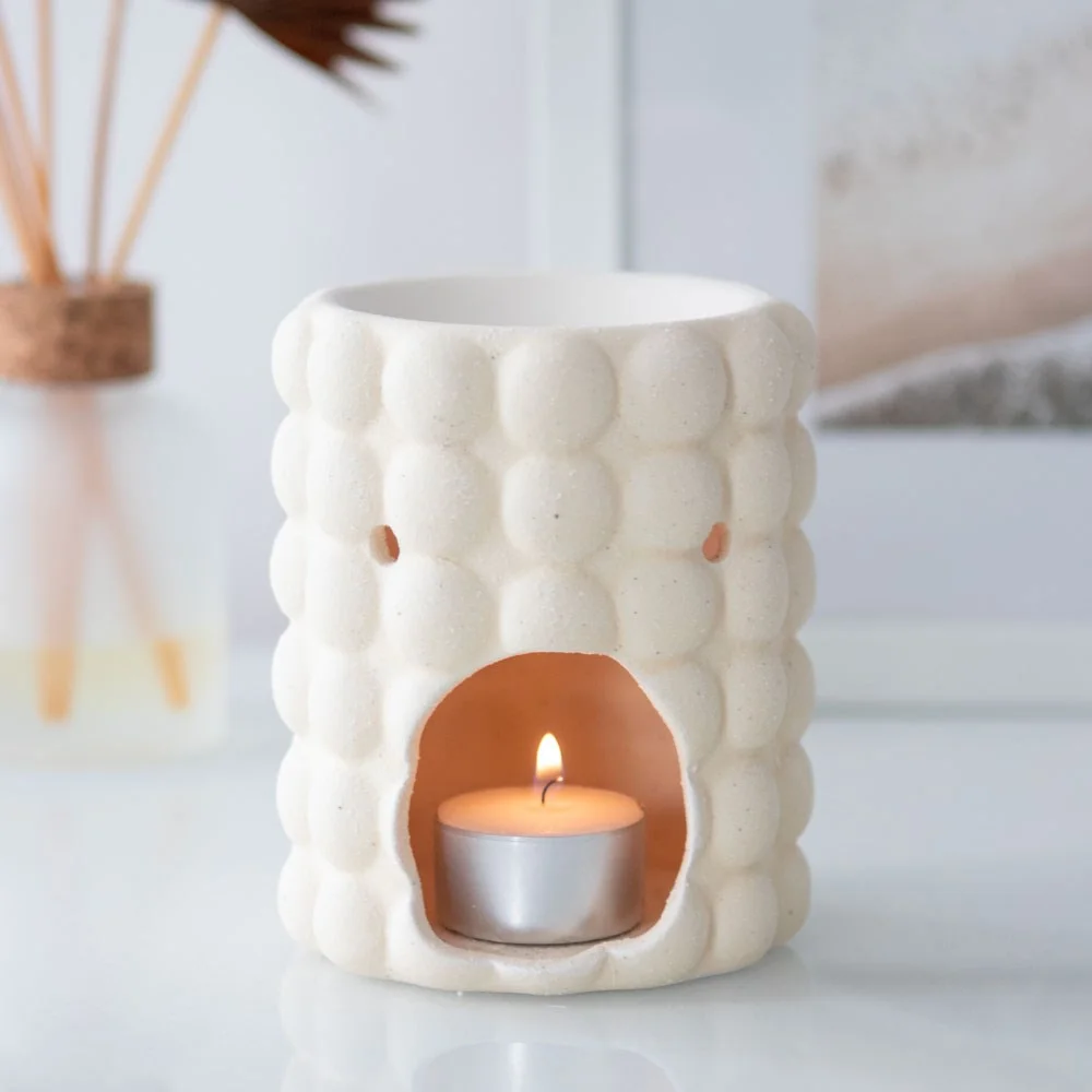 Cream speckle bubble oil burner in dolomite, textured finish, 12cm height, trendy bubble design for a quirky home.