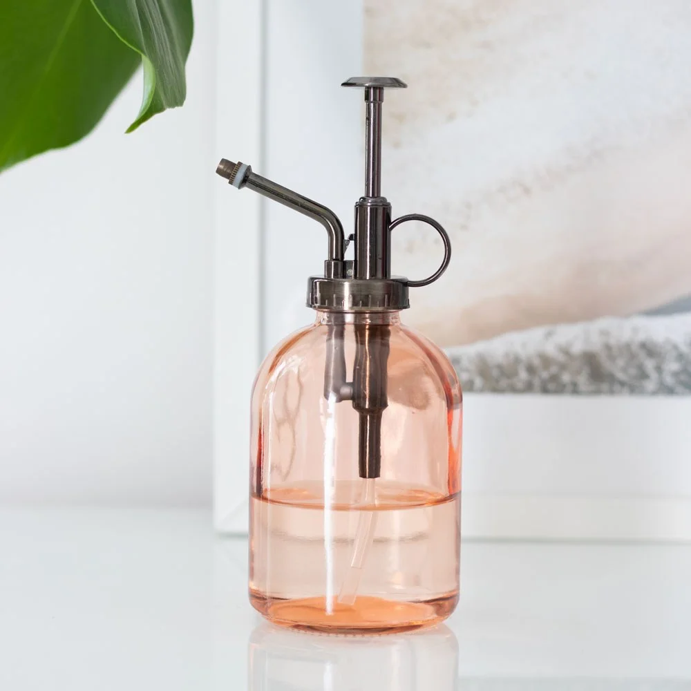 Pink minimalist glass plant mister with a muted peachy-pink finish, 19.5cm tall, ideal for indoor gardening