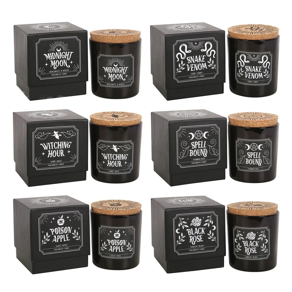 Set of scented candles with six glass jars, cork lids, and labels showing different mystical fragrance names