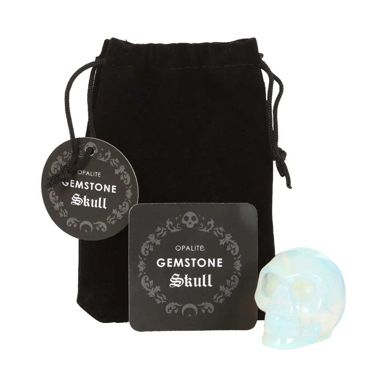 Opalite crystal skull resting on a white surface with a black drawstring pouch beside it for storage and protection