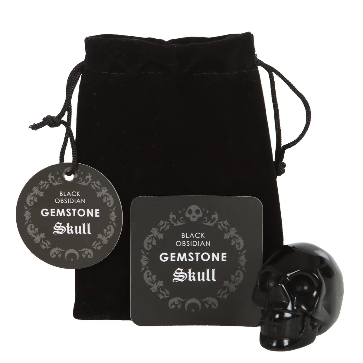 Polished black obsidian crystal skull resting on a white surface with a black drawstring pouch beside it