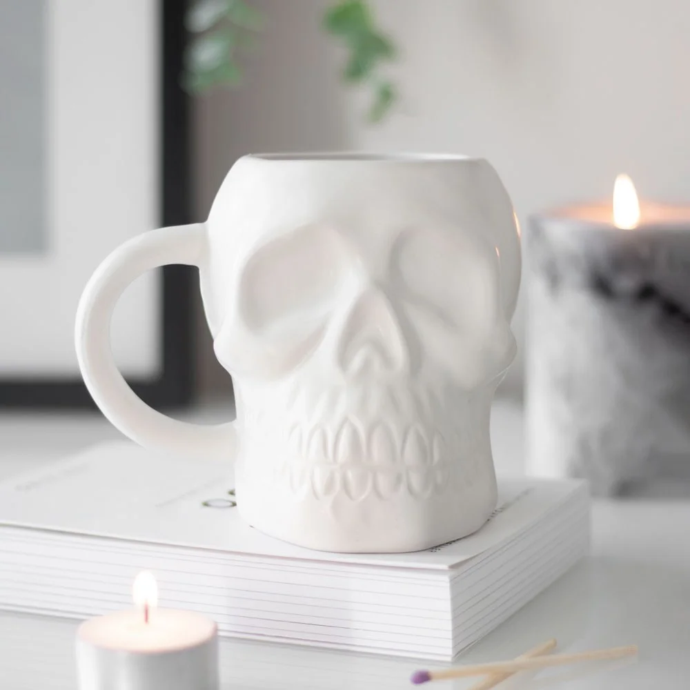 Matte white skull mug with 500ml capacity, classic skull design, handwash only, 11.2cm tall and 14cm wide