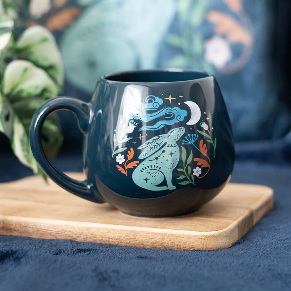Midnight hare mug with rounded shape featuring a hare gazing at the moon under a starry night sky, 400ml capacity