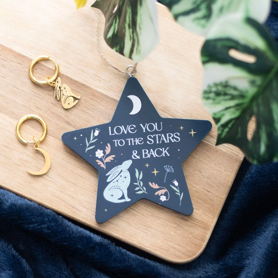 Star-shaped hare hanging decoration with "Love You to the Stars and Back" text and a whimsical hare under stars