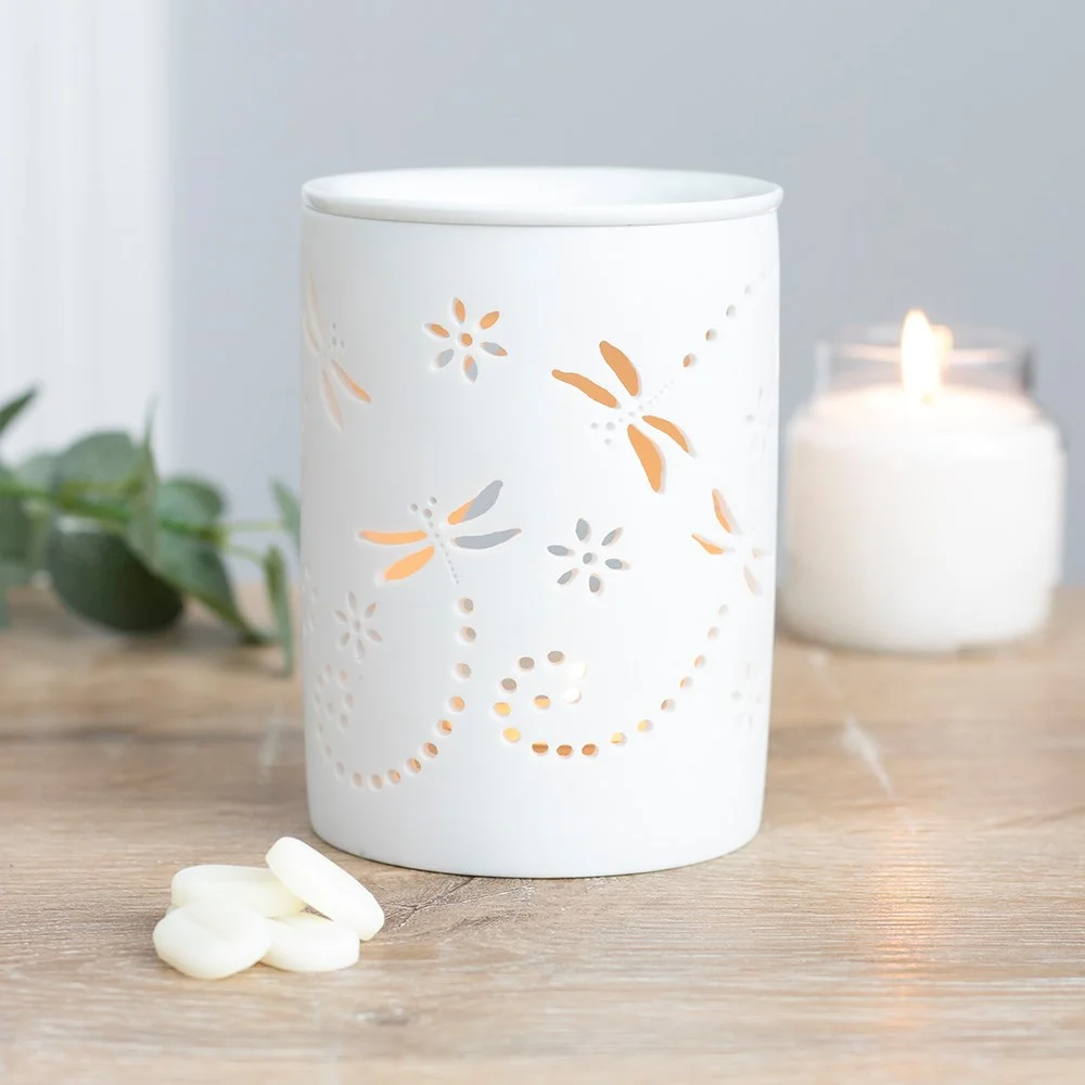 White ceramic dragonfly oil burner, cutout design, unglazed finish, shallow bowl for oil or wax.