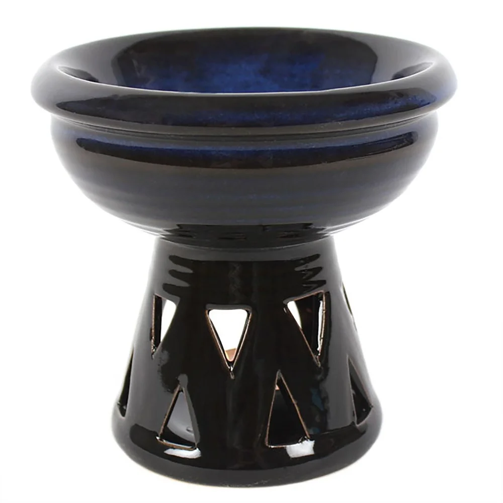 Glazed deep bowl blue oil burner with ombre effect and triangle cutouts, lit tealight underneath highlighting details