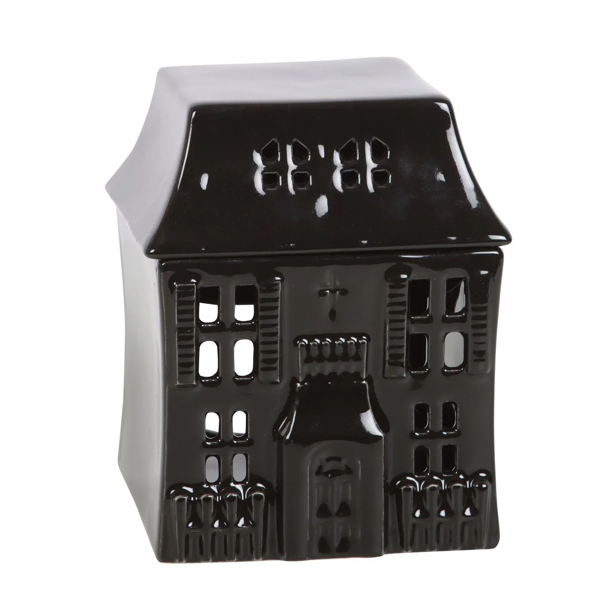 Haunted house oil burner with lit tealight inside casting eerie shadows, gothic style Halloween decor accessory