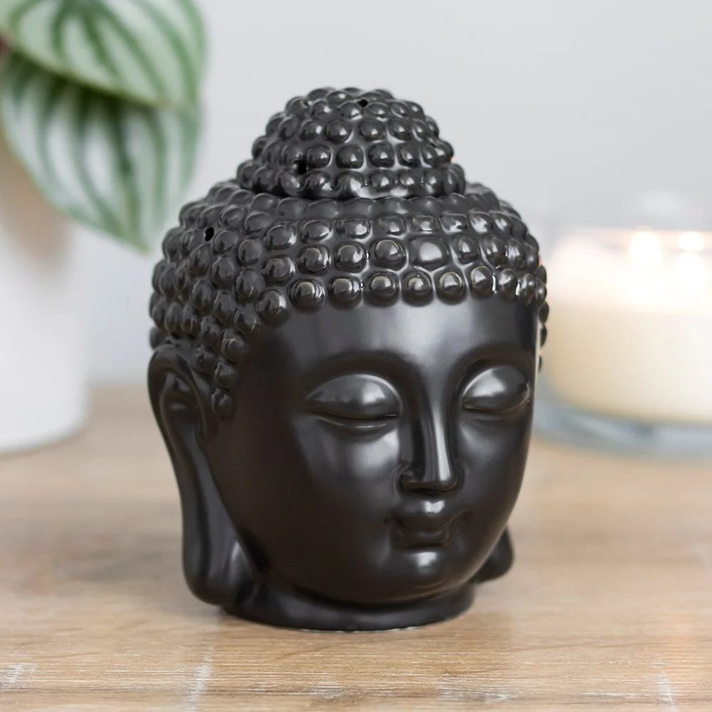 Matte black Buddha head oil burner with a bowl for wax melts, measuring 14cm tall and 9cm wide