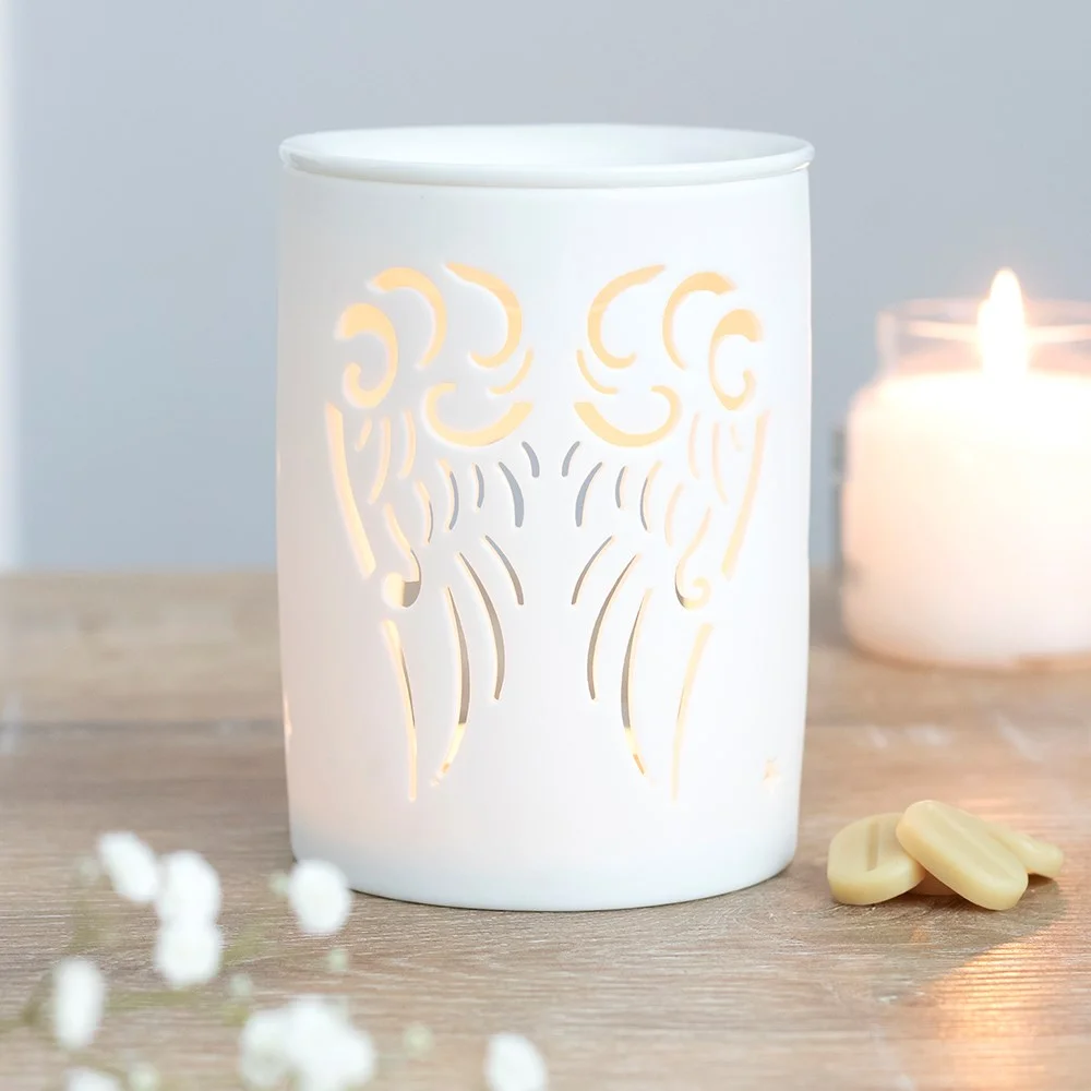 White ceramic oil burner with cut-out angel wings design, suitable for tealight and fragrance oils, white angel wings oil burner
