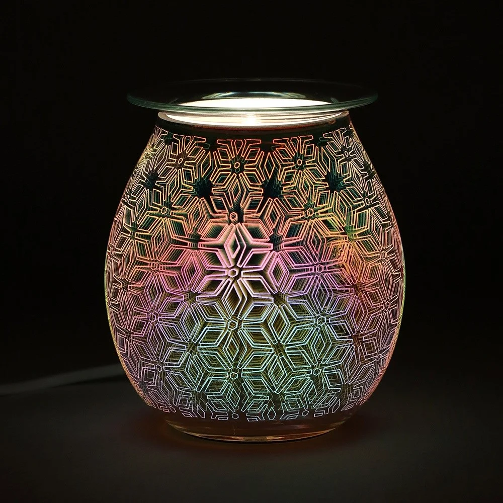 Colourful 3D geometric electric oil burner lit up, showing detailed pattern on a compact 14cm tall device