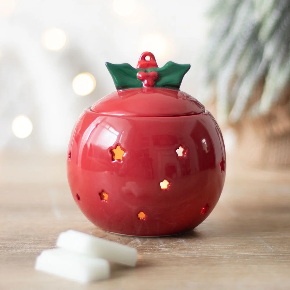 Red bauble oil burner shaped like a Christmas bauble with a small opening for tealight candle underneath