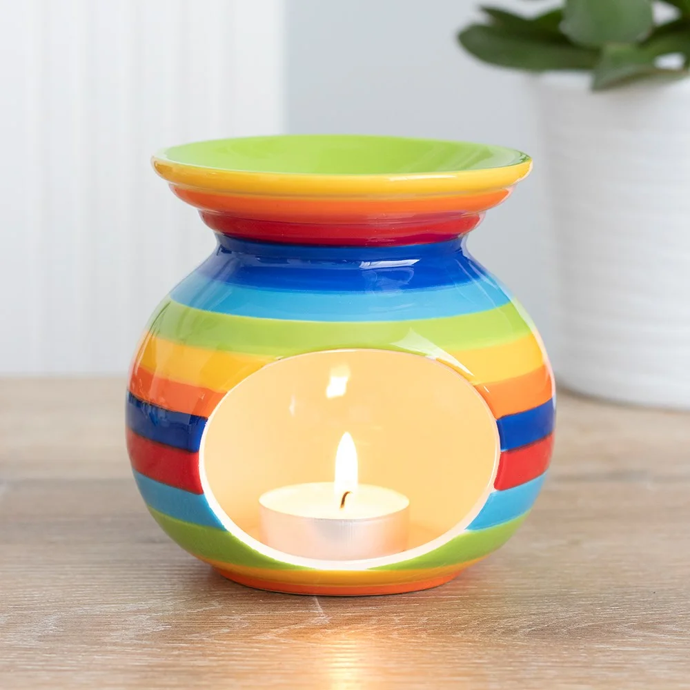 Rainbow stripe oil burner with vibrant horizontal stripes, square shape, and a hollow center for fragrance oils or wax melts