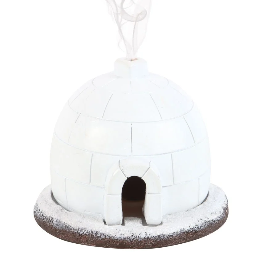 White ceramic igloo incense burner with smoke rising from the top, designed for winter and Christmas decor